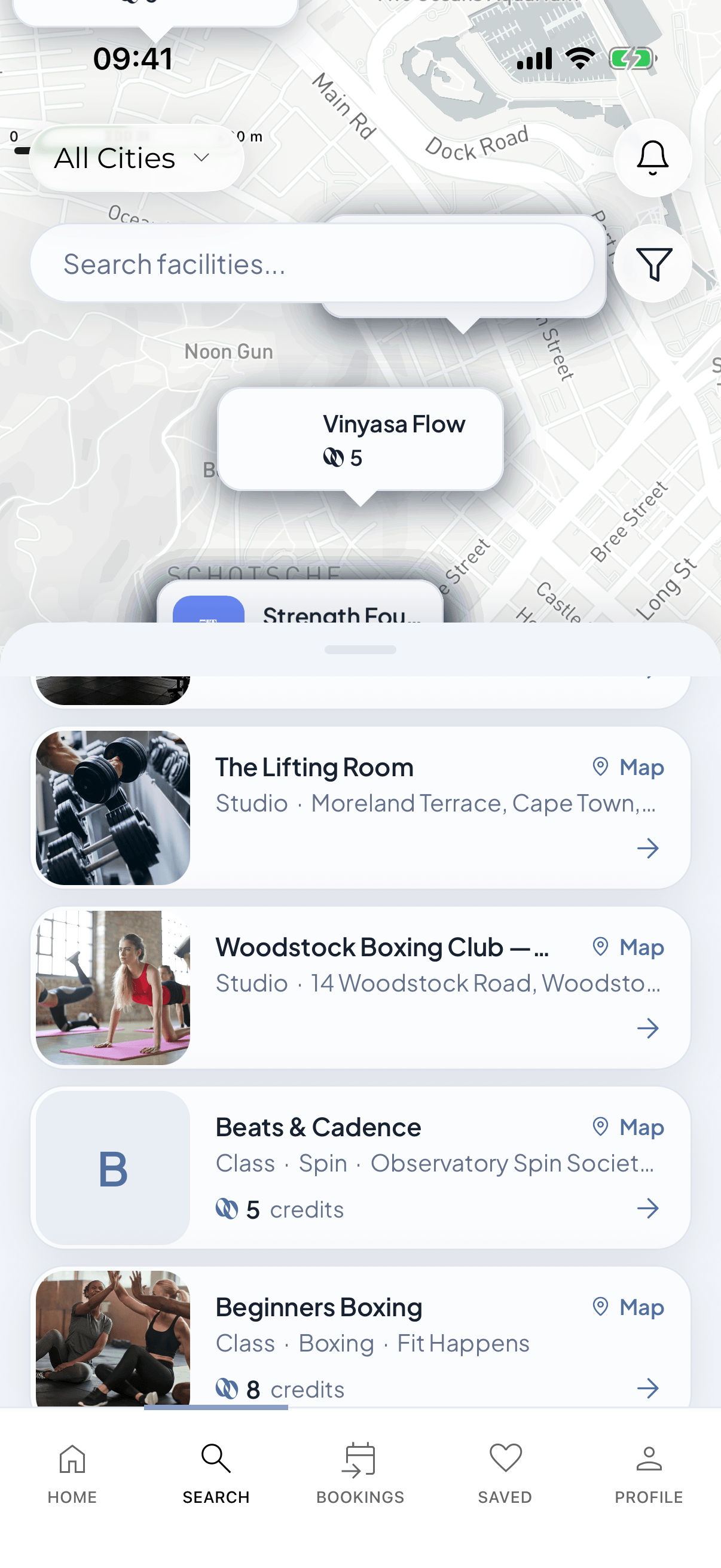 The Loop app search screen with studios on a map and a list of classes